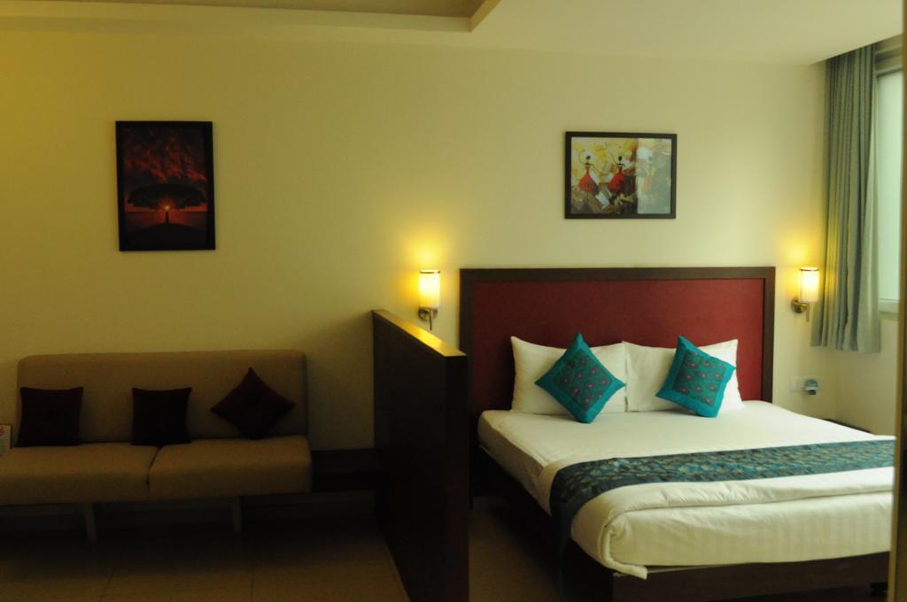 Ixora Suites Bangalore Zimmer foto