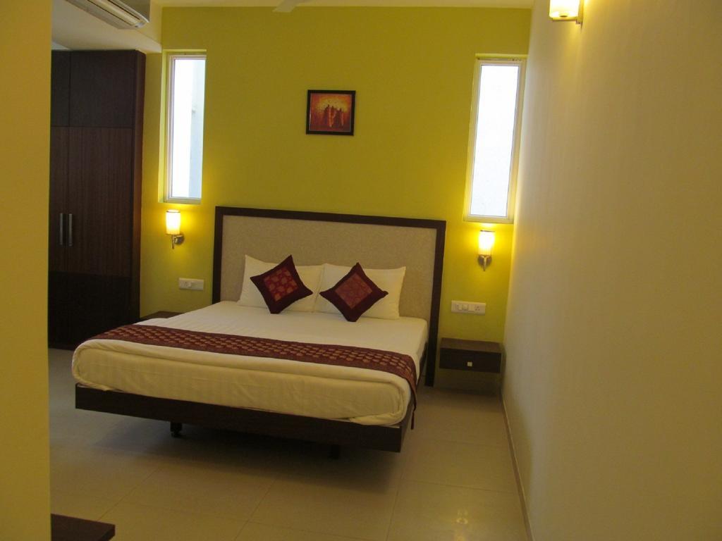 Ixora Suites Bangalore Zimmer foto